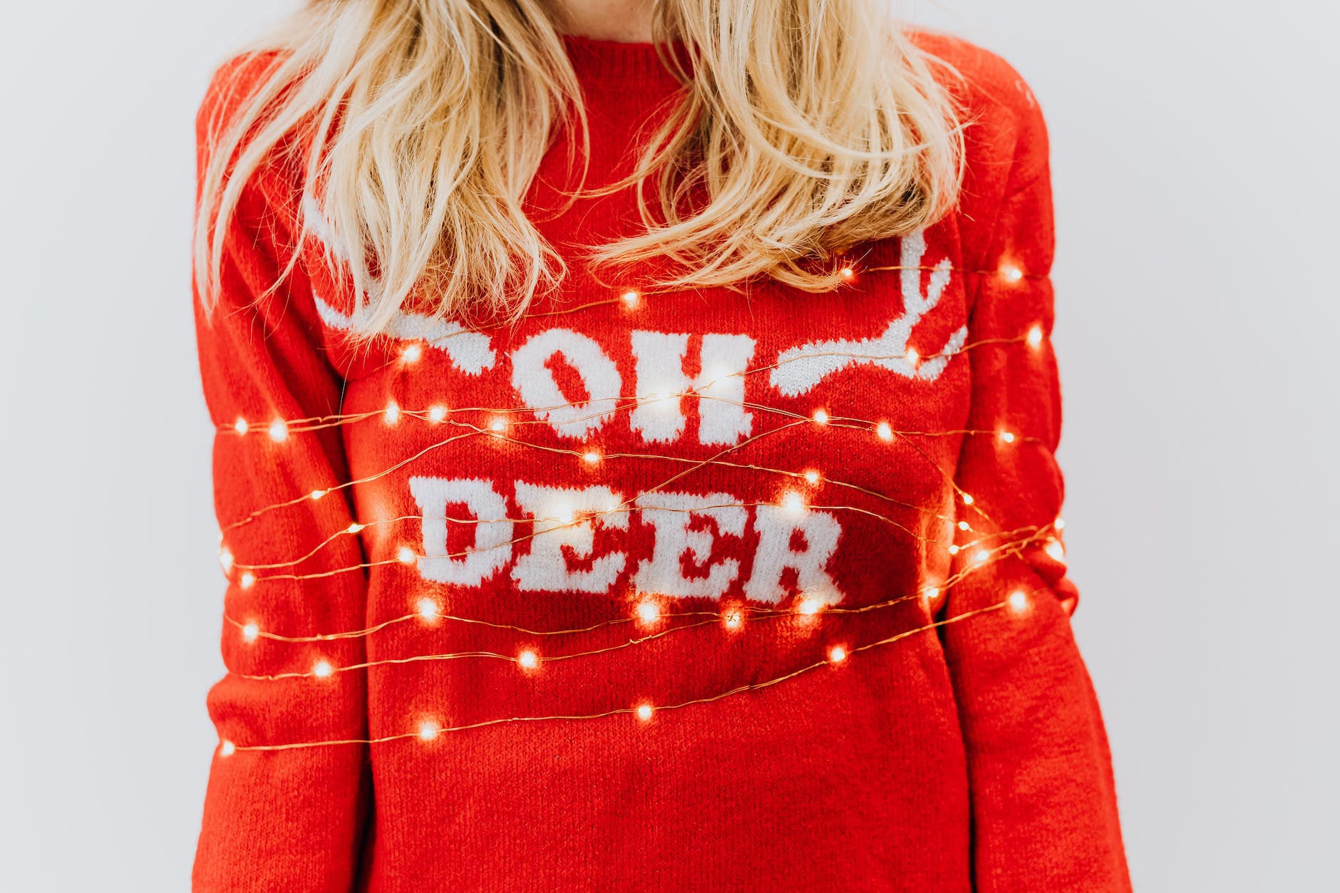 a woman in red and white christmas sweater
