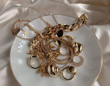 golden accessories on white saucer