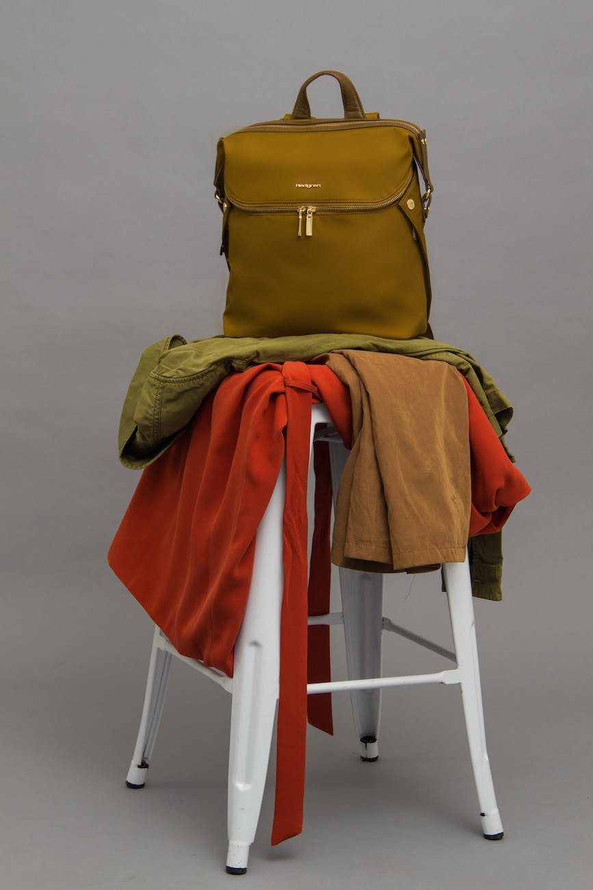 brown bag on top of stool with textiles