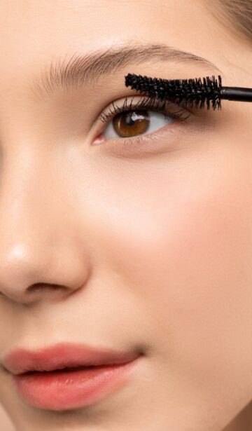 woman applying mascara