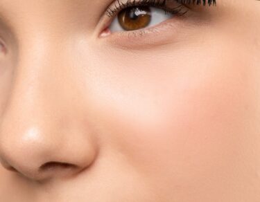 woman applying mascara