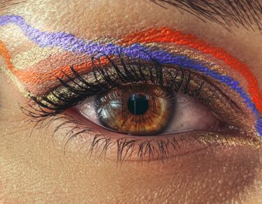 eye of crop woman with colorful makeup